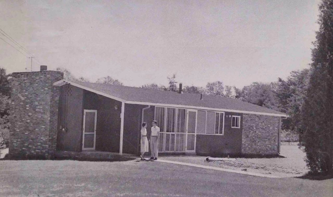 An image of a couple in front of their house in Hollin Hills.