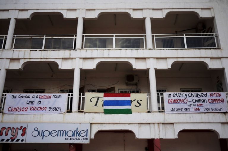 Signs on buildings in The Gambia