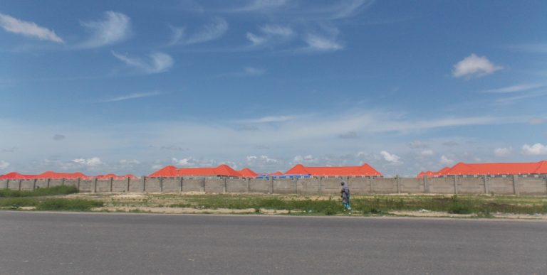 A woman walking past the Bakassi Camp